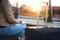 Woman waiting for train with passport, ticket and suitcase.