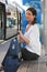 Woman waiting at tram station