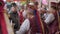 Woman waitress in folk clothes sells food and drink at city festival