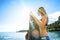 Woman is wakeboarding surfing in the water at the beach