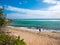 A woman walk on the beautiful deserted beach of Guanica Reserve in Puerto Rico