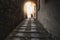 Woman walk dark street narrow alley walking in the light