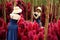 Woman walk in Fantasy Flower Dream Field with beautiful color