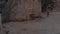 Woman walking around between fairy chimneys in Cappadocia