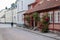 A woman is walking away on the empty street in Lund, Sweden, giving an impression of sadness or loneliness