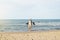 Woman walking away on the idylic beach.