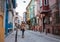 woman walking in balat turkey full of colorful house