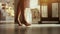 Woman is walking bare feet on uncovered floor in bright furnished room in daylight