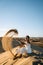 Woman walking at the beach of Maspalomas Gran Canaria Spain, girl at the sand dunes desert of Maspalomas