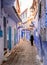 Woman walking in Chefchaouen, Morocco