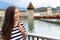 Woman walking in city of Lucerne in Switzerland