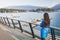 Woman walking in Coal Harbour in Vancouver city in fall, BC, Canada. Autumn travel