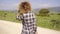 Woman Walking Down The Country Road