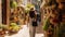 Woman walking down a narrow alleyway