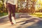 Woman walking down an outdoor trail