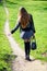 Woman walking on a footpath in the park