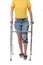 Woman with walking frame and knee orthosis