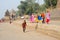 Woman walking on the ghat of Maheshwar on India