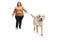 Woman walking a labrador retriever dog