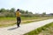 Woman walking in a park in front of El Pilar