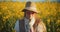 Woman Walking Through Rapeseed Field Portrait