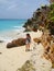 Woman walking on remote Caribbean Island beach
