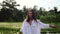 Woman is walking on rice paddy fields