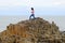 Woman walking on rocks at Giants Causeway