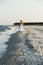 Woman walking on the sand of the beach