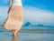 Woman walking on sand beach. Closeup detail of female feet .Step up concept.