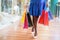 Woman walking at the shopping center with bags