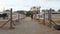 Woman walking between the stables outdoors