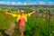 Woman walking in Swiss vineyards