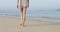 Woman Walking To Water On Beach, Young Girl Back Rear View