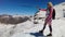 Woman walking with trekking poles