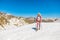 Woman walking with trekking poles