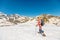 Woman walking with trekking poles