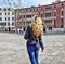 Woman walking in Venice Italy. Traveler or tourist girl exploring the city