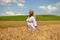 Woman walking in wheat field