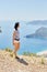 Woman walks along the Lycian Way trail. Fethiye, Oludeniz. Beautiful view of the sea and the beach. Hiking in the mountains of