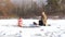 Woman walks into cold, icy water.