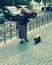 A woman walks a dog in Odessa, Ukraine - EUROPE - DOGS