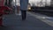 Woman walks on empty railway station as train departs