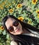 Woman walks through a field of sunflowers full of happiness in fullness, with tranquility, relaxation, calm, peace and splendor