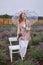 Woman walks in flowering fields of lavender with umbrella and enjoys summer rest. shallow depth of field photo