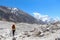 Woman walks on Ngozumpa glacier in Himalayas