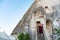 Woman walks up old stairs in ancient volcanic cave in Cappadocia