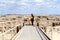 Woman on walkway in the Badlands National Park, South Dakota.