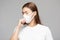 Woman waring protection mask from coronavirus and air pollution coughing so sickness