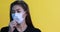 woman waring protection mask from coronavirus and air pollution coughing so sickness